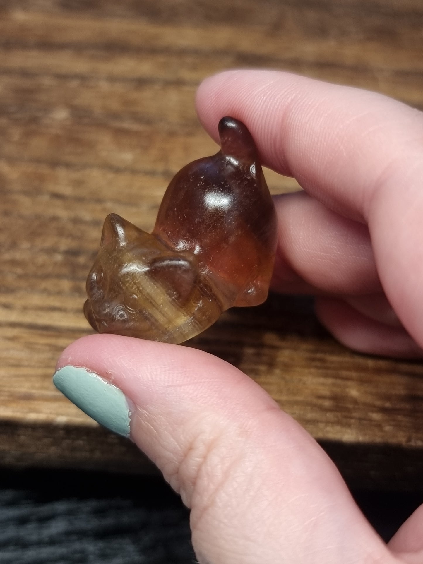 Fluorite playing cat carvings