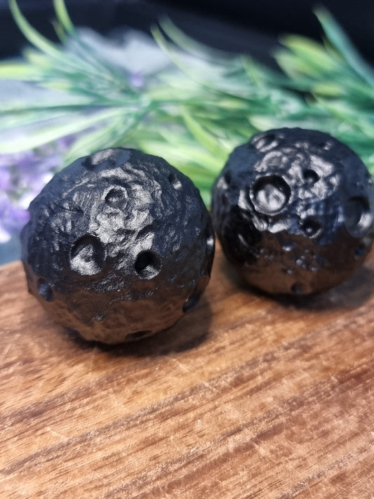 Obsidian moon carvings