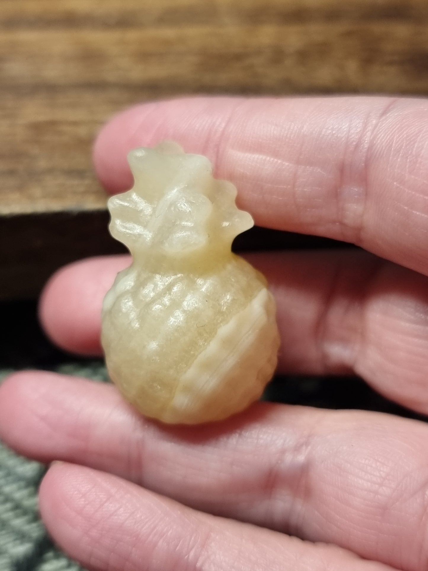 Orange calcite pineapple carvings