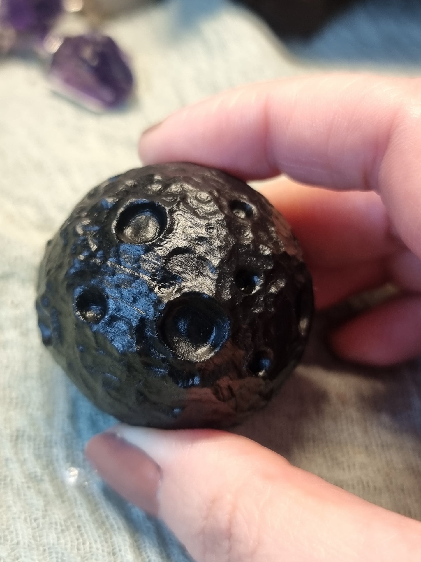 Obsidian moon carvings
