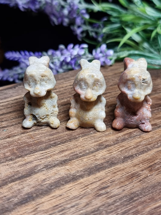 Coral rabbit carvings