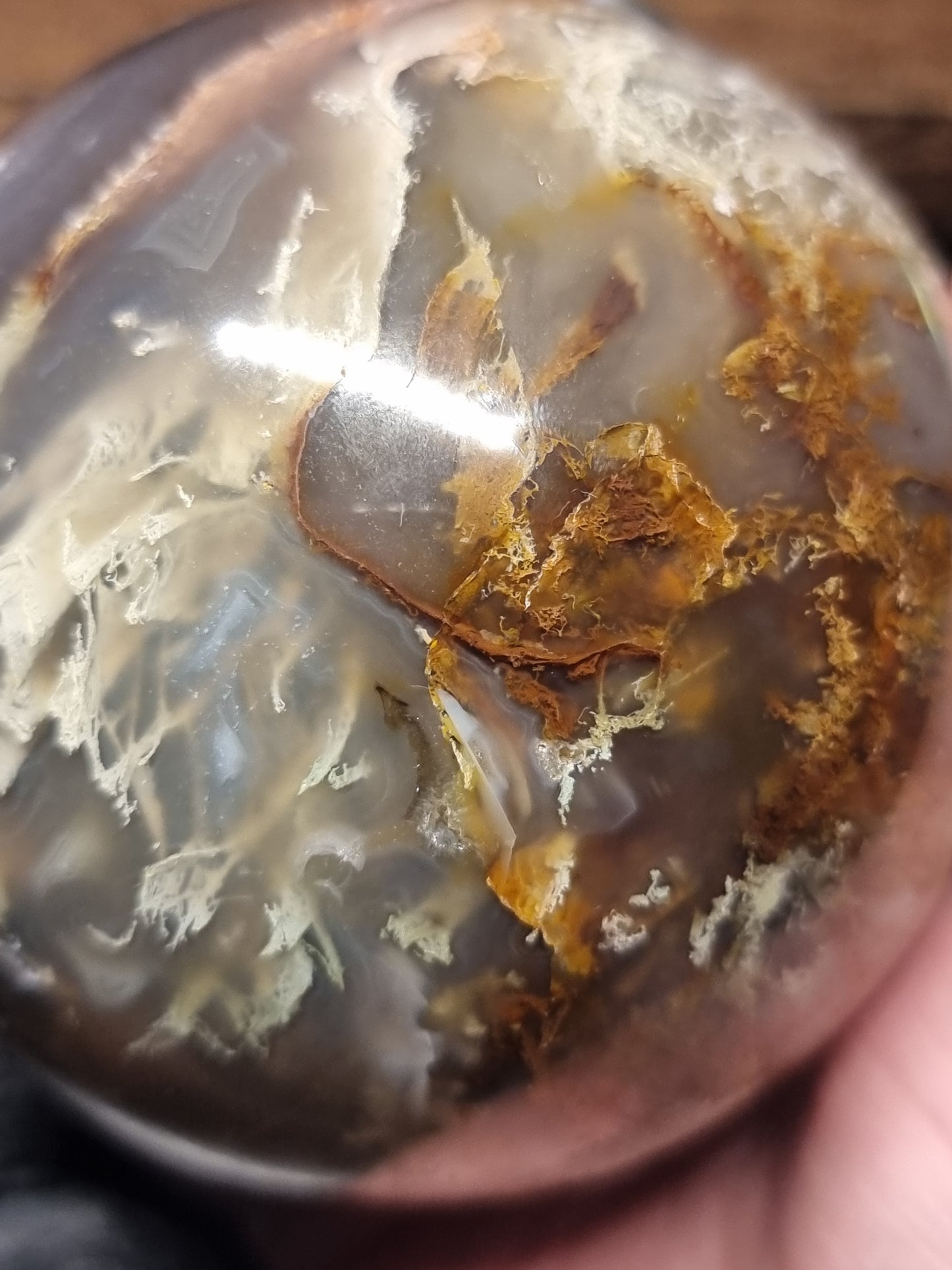 Colourful Moss agate sphere with small orca agate inclusions