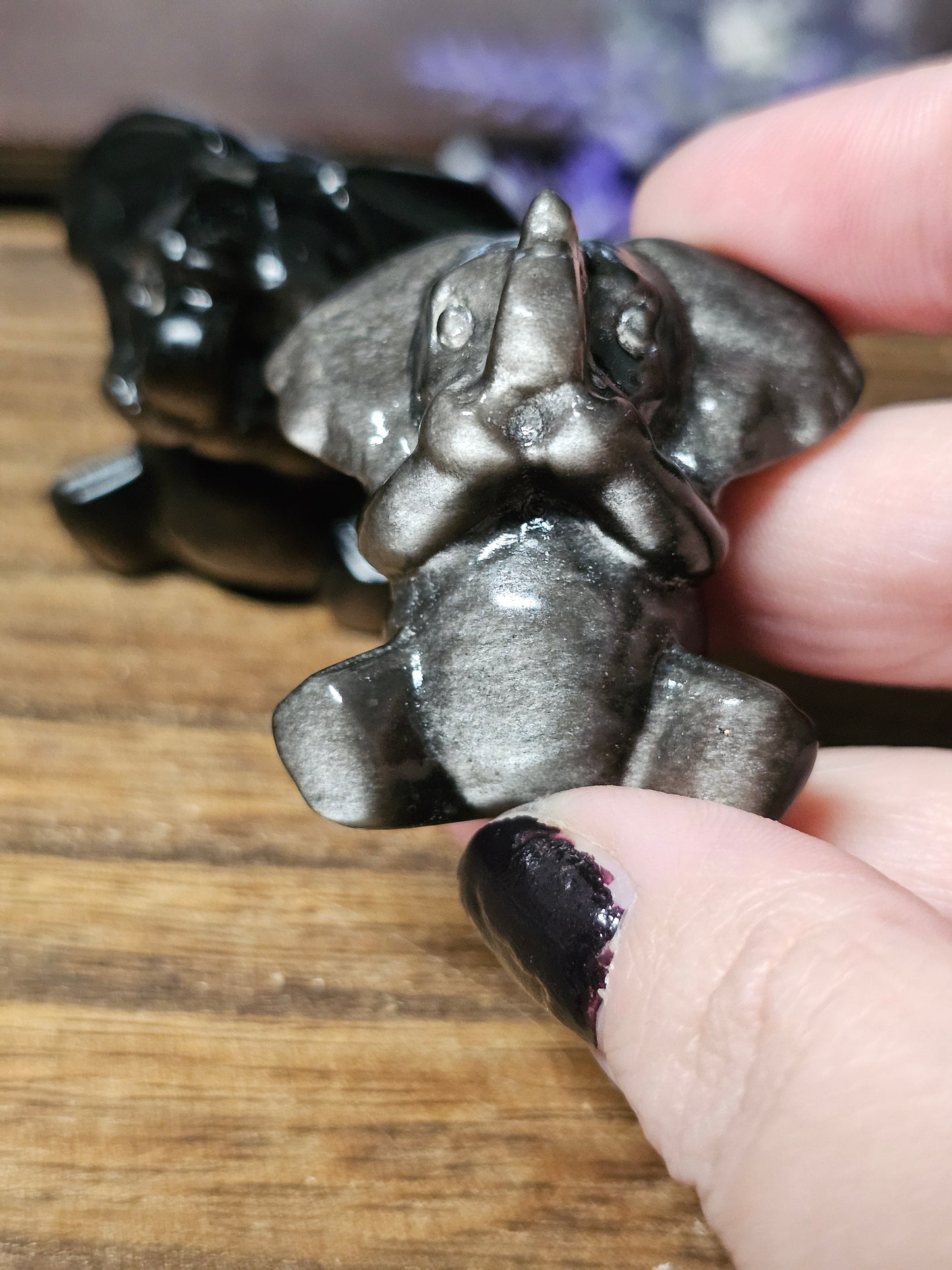 Silver obsidian elephants