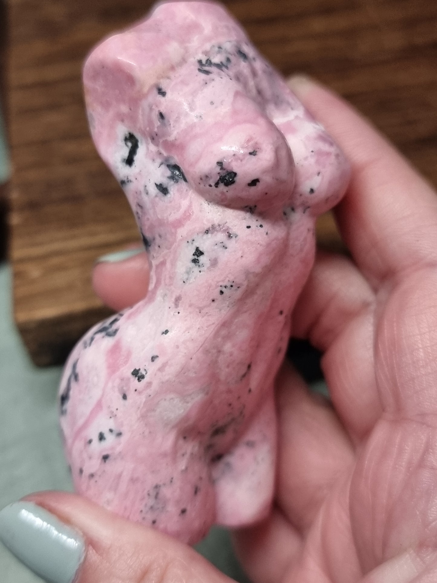 Peruvian rhodonite body carving