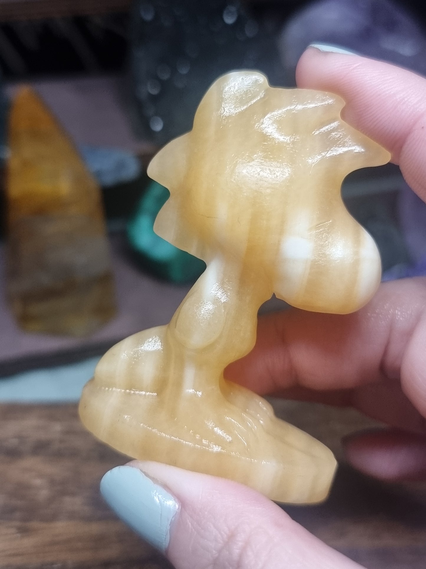 Orange calcite Woodstock snoopy carving