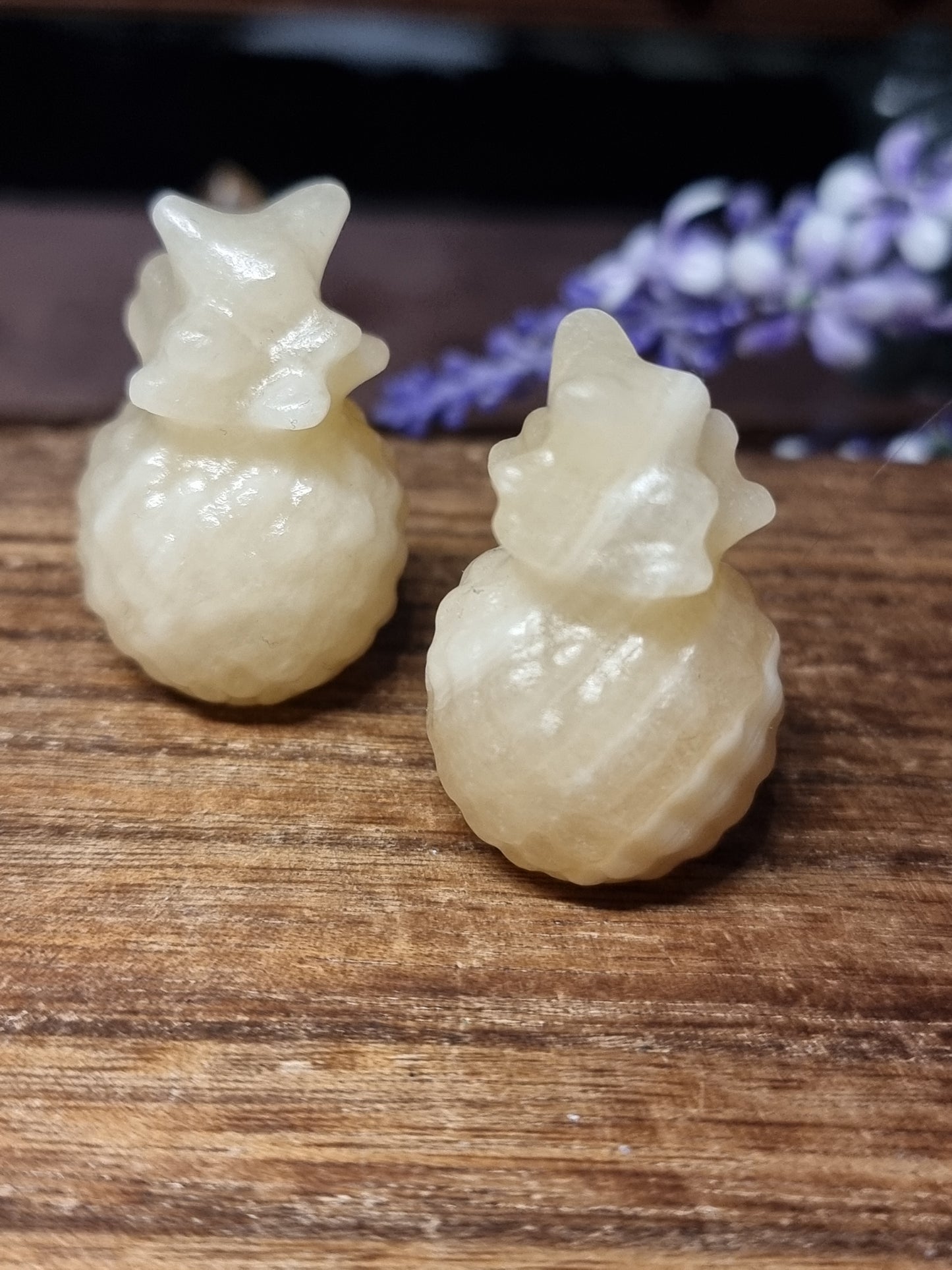 Orange calcite pineapple carvings