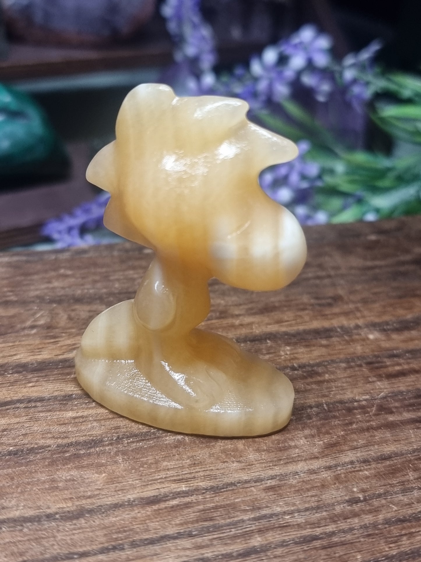 Orange calcite Woodstock snoopy carving