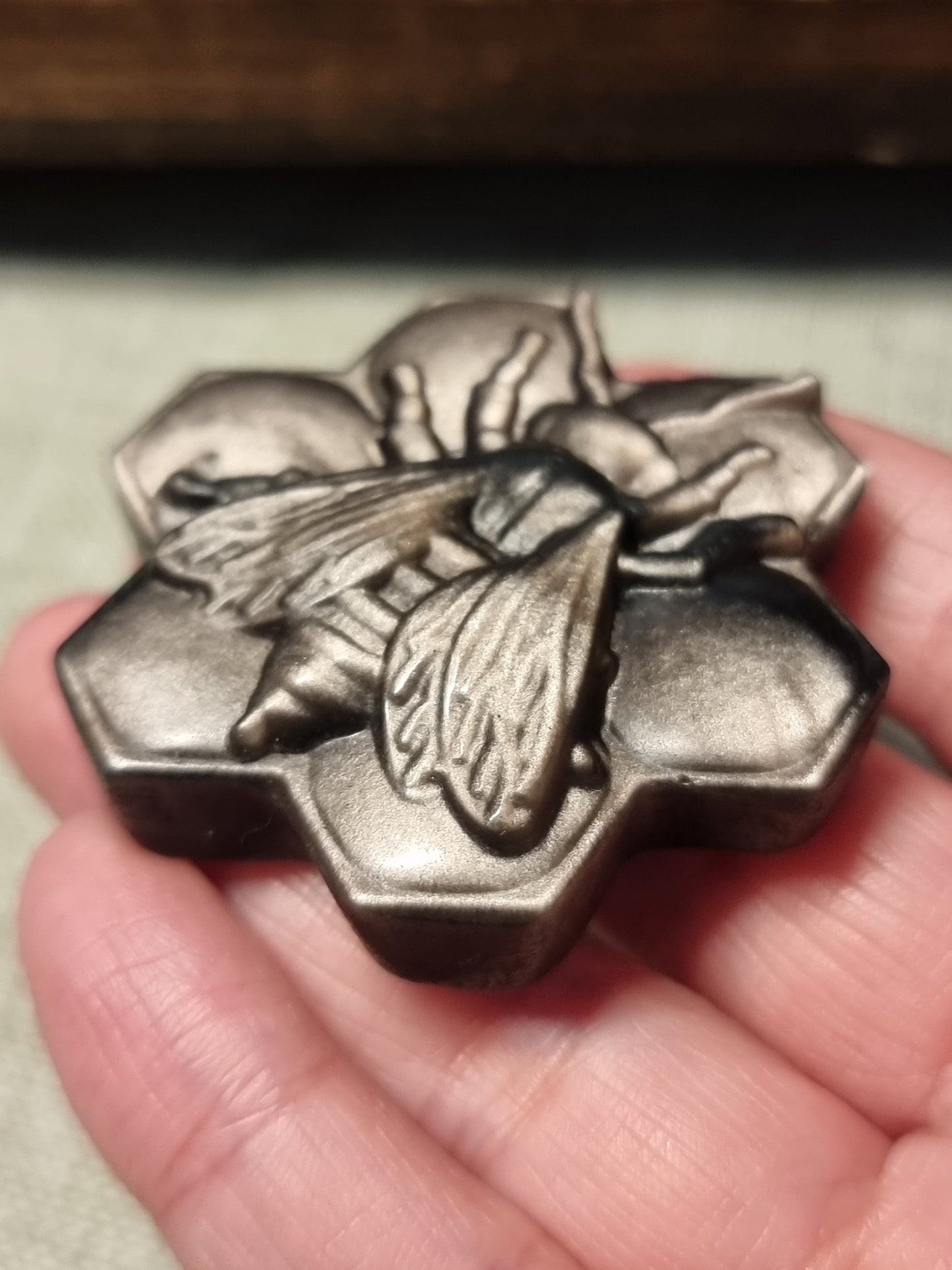Silver obsidian bee carvings