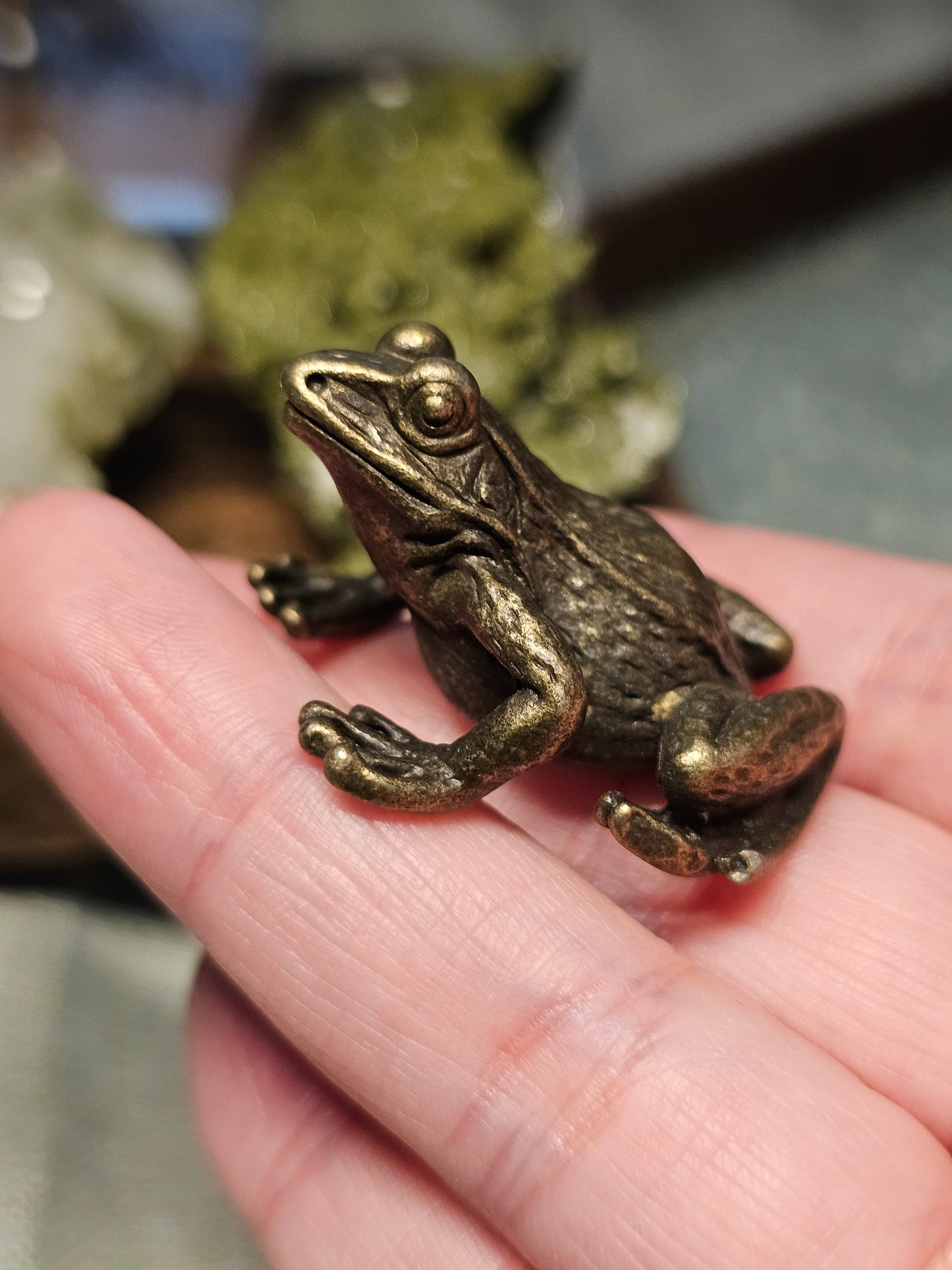 Brass frog carvings