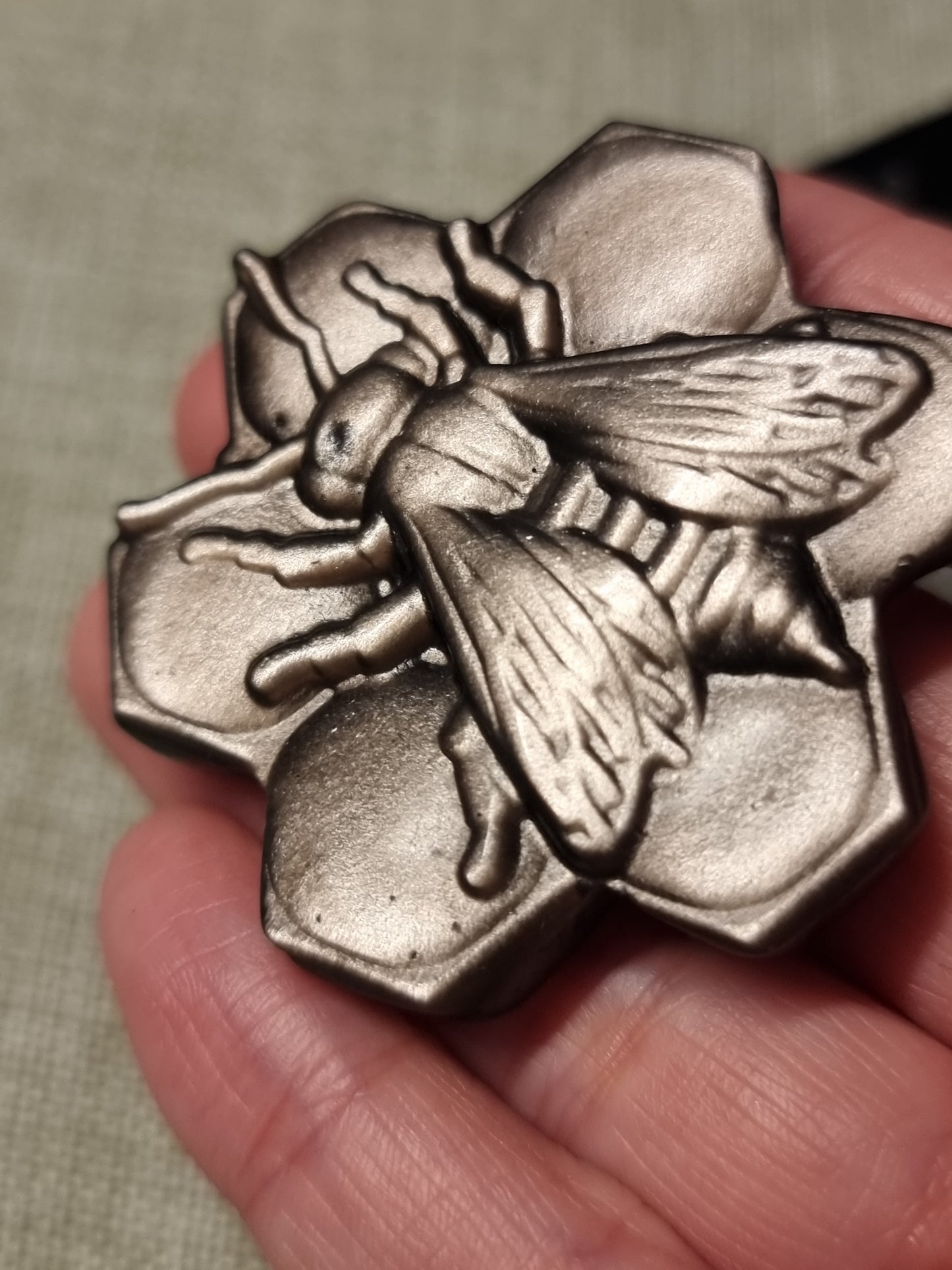 Silver obsidian bee carvings
